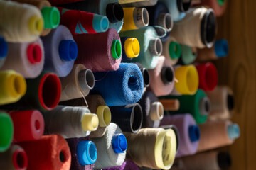 Spools of multi-colored threads.