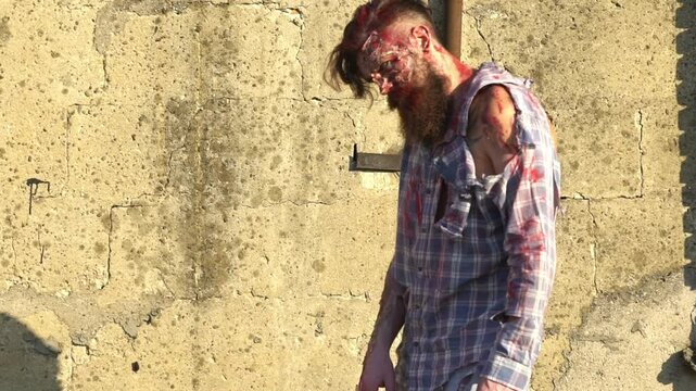 Halloween. zombie man. Creepy man with bloody scars Halloween face. Man zombie with blood on face. Creative art make-up for Halloween. Man face Scary zombie. Terrible nightmare Halloween horror party.