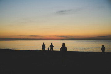 silhouette of people on the beach