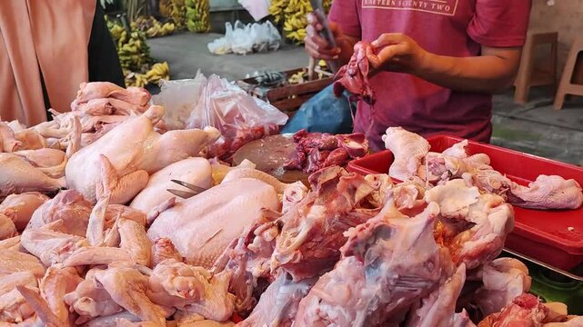 broiler chicken seller at Indonesian traditional market