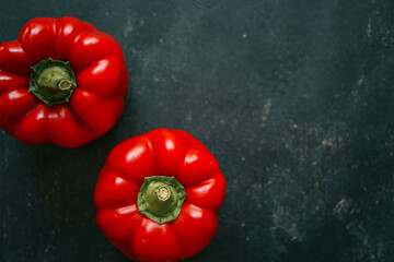 Red bell pepper on black background