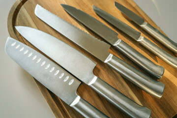 Casting steel various chef knife, Set of modern sharp kitchen knives on light background