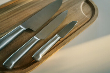 Casting steel various chef knife, Set of modern sharp kitchen knives on light background