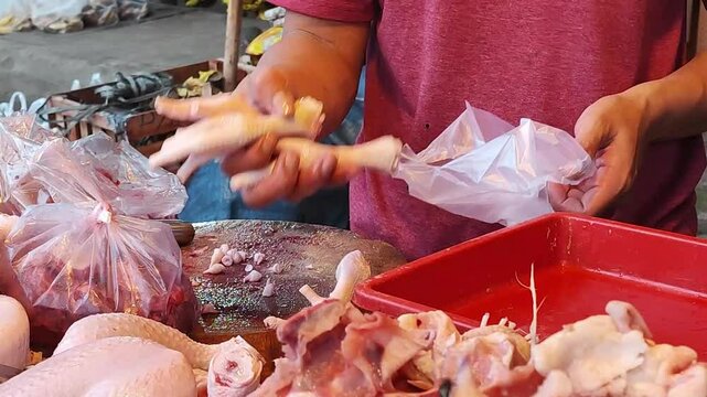 broiler chicken seller at Indonesian traditional market