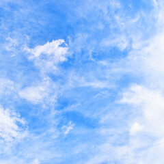 beautiful blue sky and white fluffy group of clouds with sunrise in the morning, natural background
