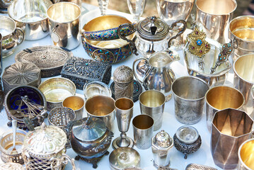 Antique silver tableware at flea market