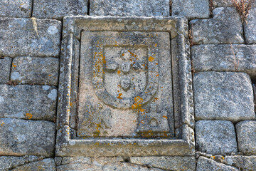 Granite logo shield castle in Trancoso Portugal