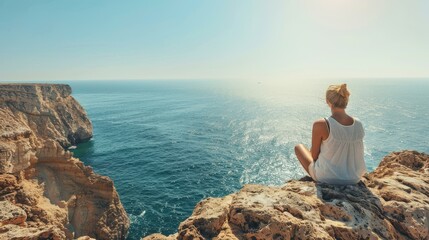 Woman Sitting on Cliff Overlooking Ocean, Blue Sky, Summer Vacation