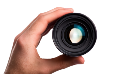 Hand holding a camera lens viewed from the front, focusing on the glass elements cut out transparent isolated PNG