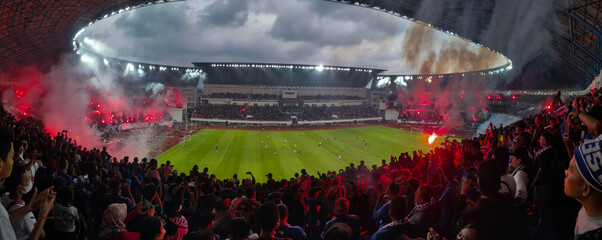 Obraz na płótnie Canvas Panoramic wide-angle view inside the Stadion Jatidiri, Semarang after win celebration, home stadium for PSIS Semarang.