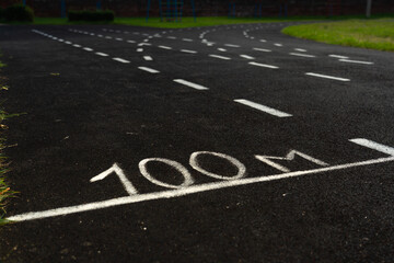 Obraz premium A rubber treadmill at the stadium. White markings on the stadium track
