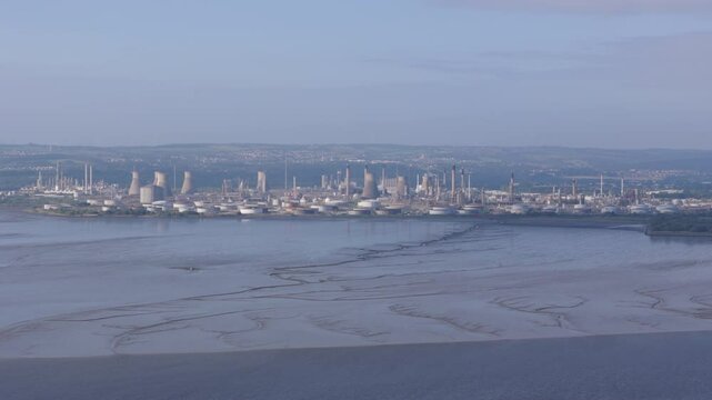 Aerial view of oil and gas refinery in the United Kingdom. Petrochemical industry. Climate change concept. Large scale industrial plant.