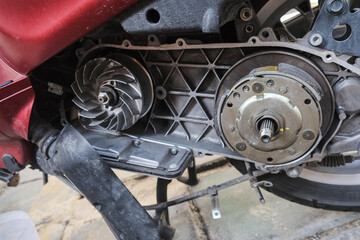 Fototapeta premium Mechanical working on automatic CVT transmission of scooter mortorcycle repair belt and clutch