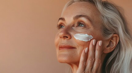 No filter close up photo of pretty cute senior woman apply cream face isolated on beige color background : Generative AI