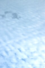 Clear blue sky. Light cloud ripples.