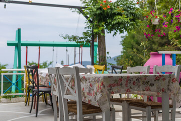 Summer restaurant. Tables and chairs with sea view