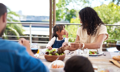 Mother, girl and outdoor by table for lunch with food for prepare feast, happy and together for festive holiday. Mom, daughter and home for thanksgiving celebration, tradition and family with love.