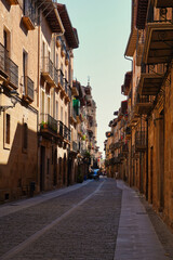 Puente de La Reina, Navarra.  The tower of the church of Santiago el Mayor rises, immense, over the roofs of the town