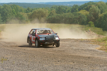 Autocross on a dirt track. rally race. Off-road racing. Training races of racing drivers. Modern modified cars on the road.