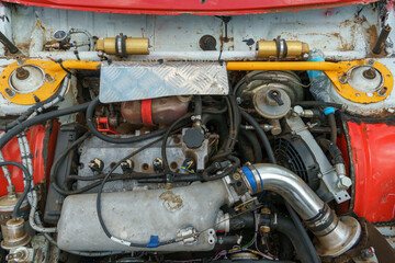 Car engine close-up. Car repairs. A car with an open hood.