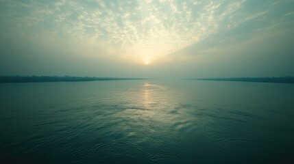 Obraz premium Sacred Ganges River flowing with space for text in the sky or water. Holy river in Hinduism.