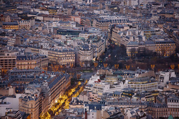 Fototapeta premium Aerial view of a city adorned with lights along central street