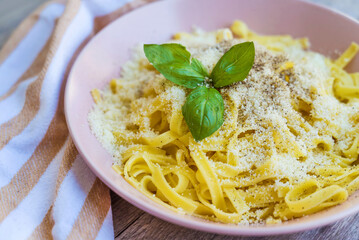Tagliatelle with parmesan and basil  .Italian pasta 