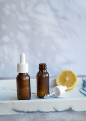 Amber Glass bottle with vitamin C . Vitamin C serum with lemon  fruit
