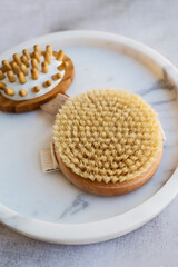 Wooden brush for anti-cellulite body massage at home . Body care at home.