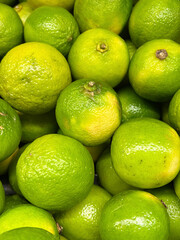 Many green limes background .Close up 