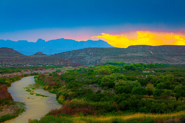 Sunset picture showing Rio Grande River flowing into Boquillas Canyon.