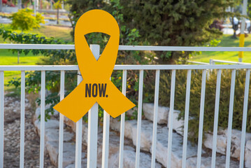 “Bring them home now” Installation of yellow ribbons in park, tied between trees as a symbol advocating for the return of hostages and raising awareness for those who are missing or held captive.