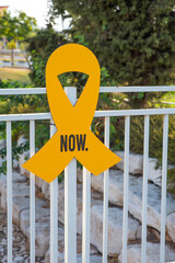 “Bring them home now” Installation of yellow ribbons in park, tied between trees as a symbol advocating for the return of hostages and raising awareness for those who are missing or held captive.