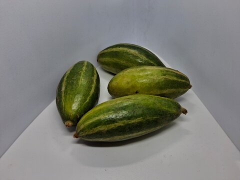 pointed gourd or parwal : "Fresh, vibrant pointed gourd with smooth, green skin, ideal for healthy dishes and traditional recipes, showcasing natural, crisp freshness."