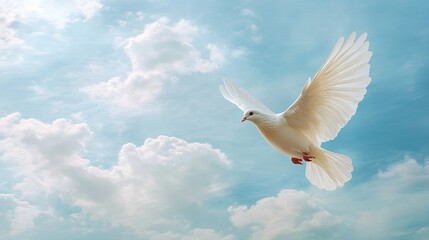 A white dove soars high in a clear blue sky, wings spread wide, symbolizing freedom and peace, with soft clouds in the background.