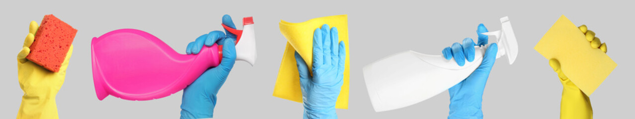 Janitors holding different cleaning supplies on light grey background, closeup