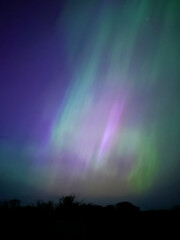 Gorgeous and rare extreme solar storm creating rare Northern Lights or Aurora Borealis in an amazing light show over Onchan on the Isle of Man