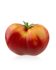 Red ripe organic tomatoes in a plate on the table