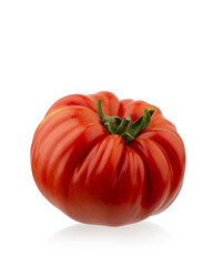 Red ripe organic tomatoes in a plate on the table