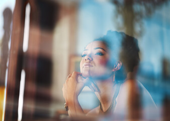 Woman, relax and thinking by window at cafe for morning, reflection or daydreaming of future. Calm,...