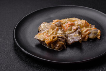 Delicious boiled beef or pork tongue sliced with carrots, onions, sour cream