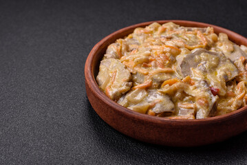 Delicious boiled beef or pork tongue sliced with carrots, onions, sour cream