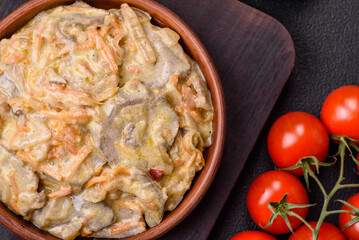 Delicious boiled beef or pork tongue sliced with carrots, onions, sour cream