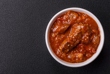 Thai Asian dish with meat, hot pepper, tomato sauce and sesame