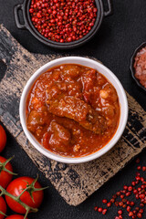 Thai Asian dish with meat, hot pepper, tomato sauce and sesame