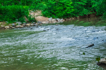 Obraz premium The tranquil waters remind us to pause and enjoy the moment, Little River, Woodstock, Georgia, United States of America