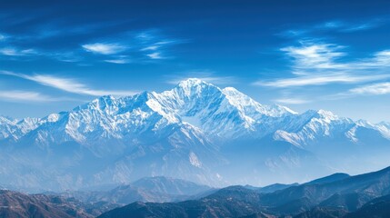 Obraz premium Majestic snow-capped mountain peak under a clear blue sky, offering breathtaking panoramic views of nature and tranquility.