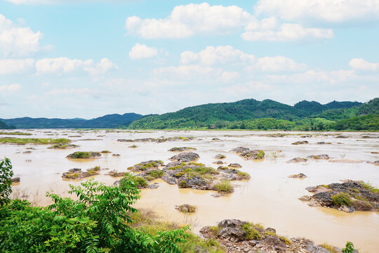 Landscape riverside of brown water eroded rocks and islets in mekong river at sangkhom district, Nong Khai province, Thailand.