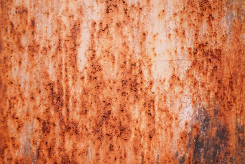 Rusty metal background with streaks of rust. The metal surface rusted spots. Rust on the wall use as illustration for presentation. Rusty corrosion and oxidized on white background.