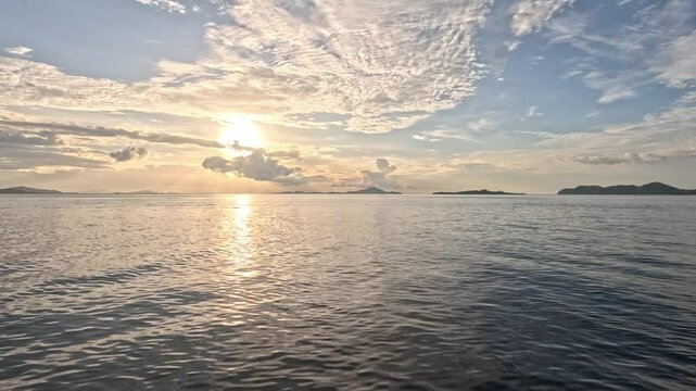 Calm Indian Ocean at sunset near Rinca island